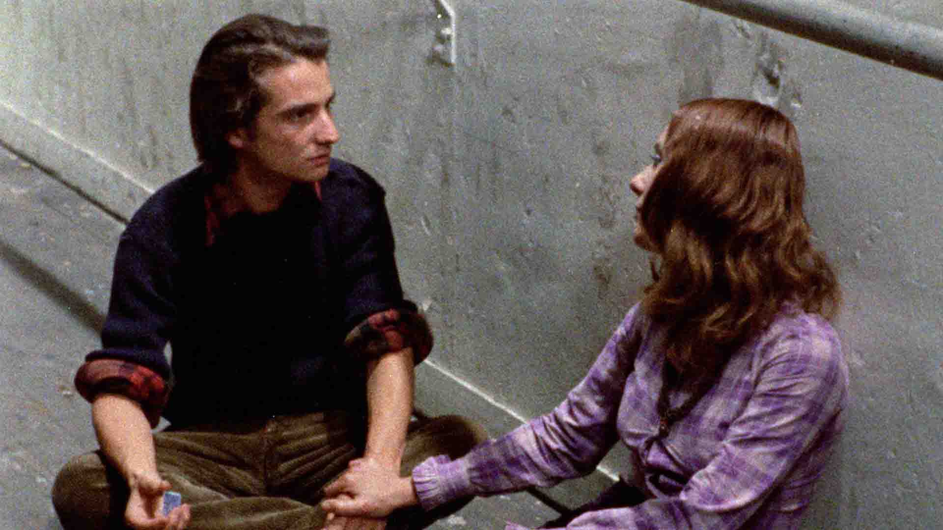 A man and a woman talking to each other in the movie Out 1