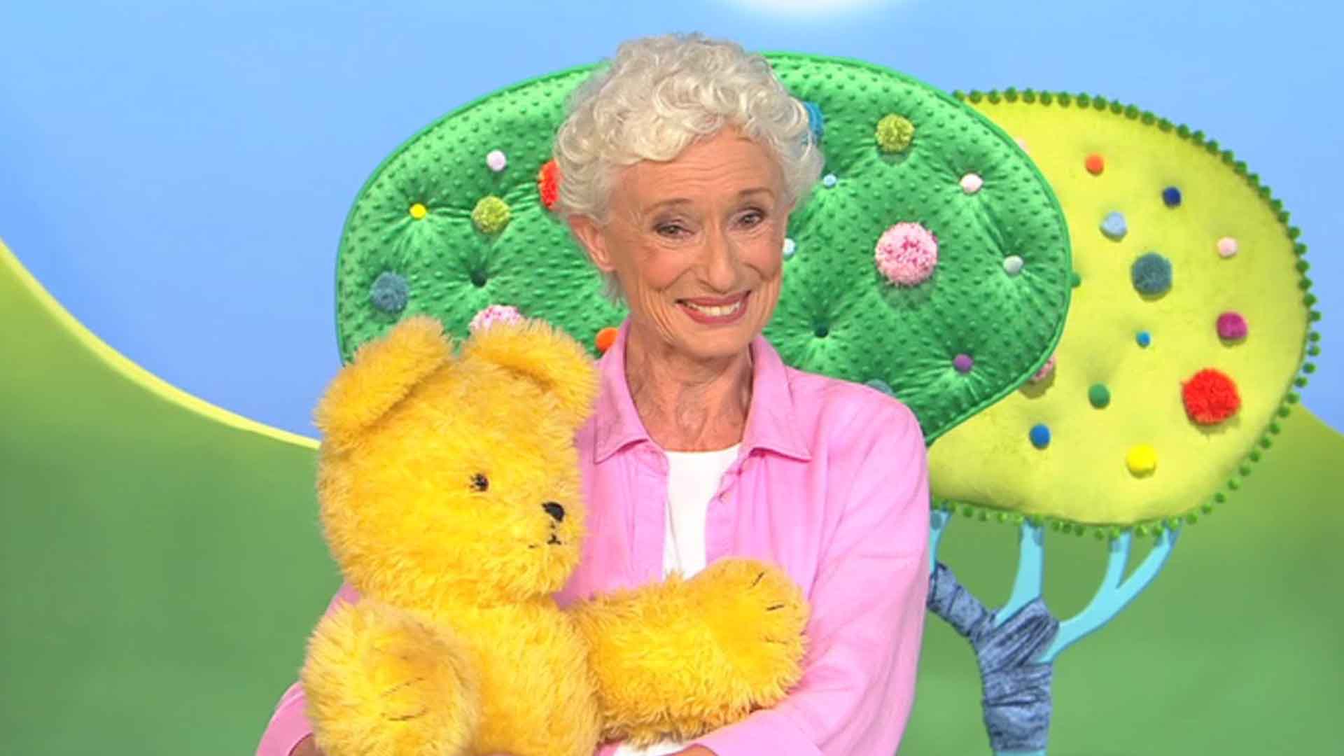 An old woman with a doll in the Play School series