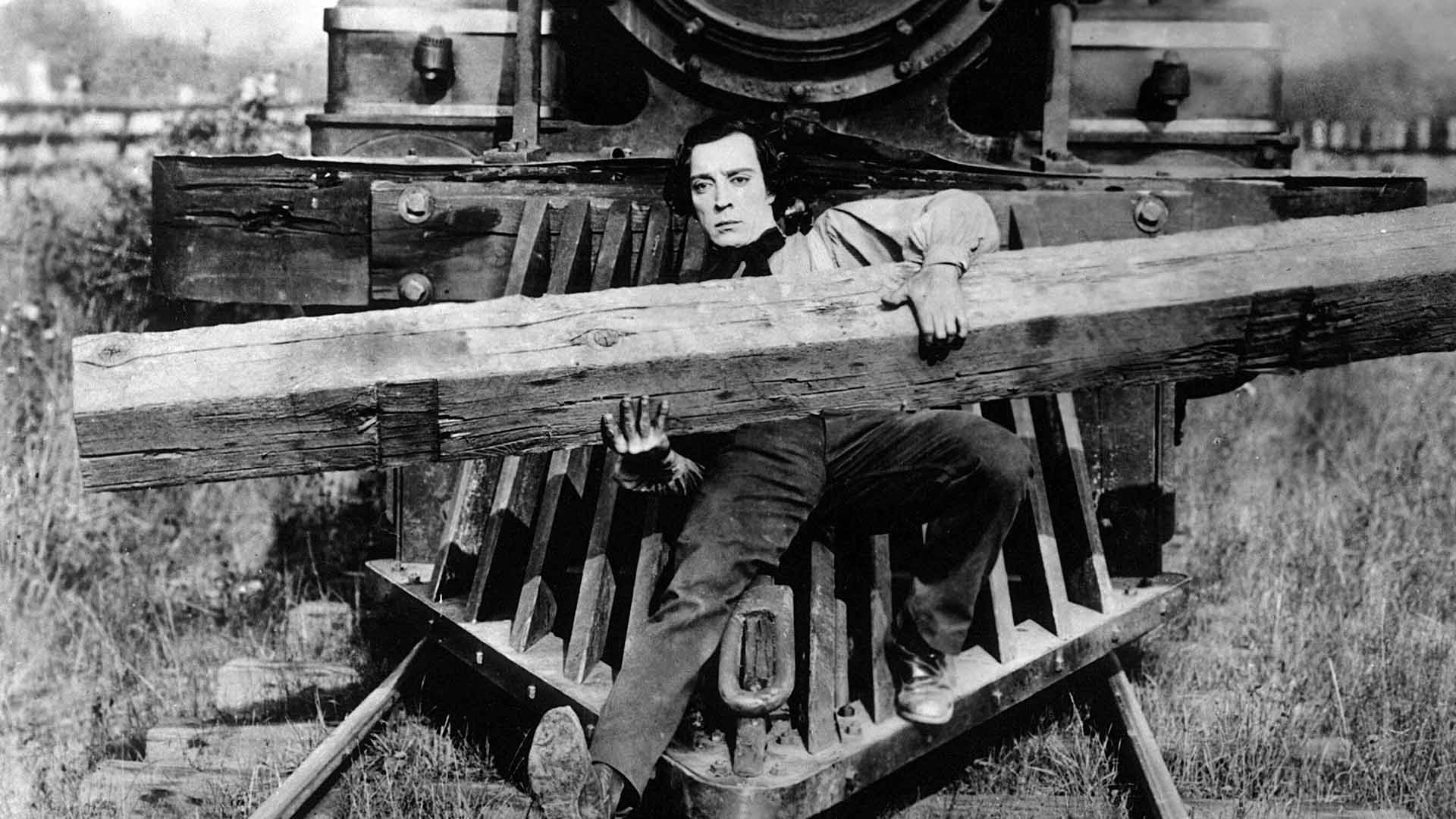Buster Keaton in The General falls in front of the train with a piece of wood
