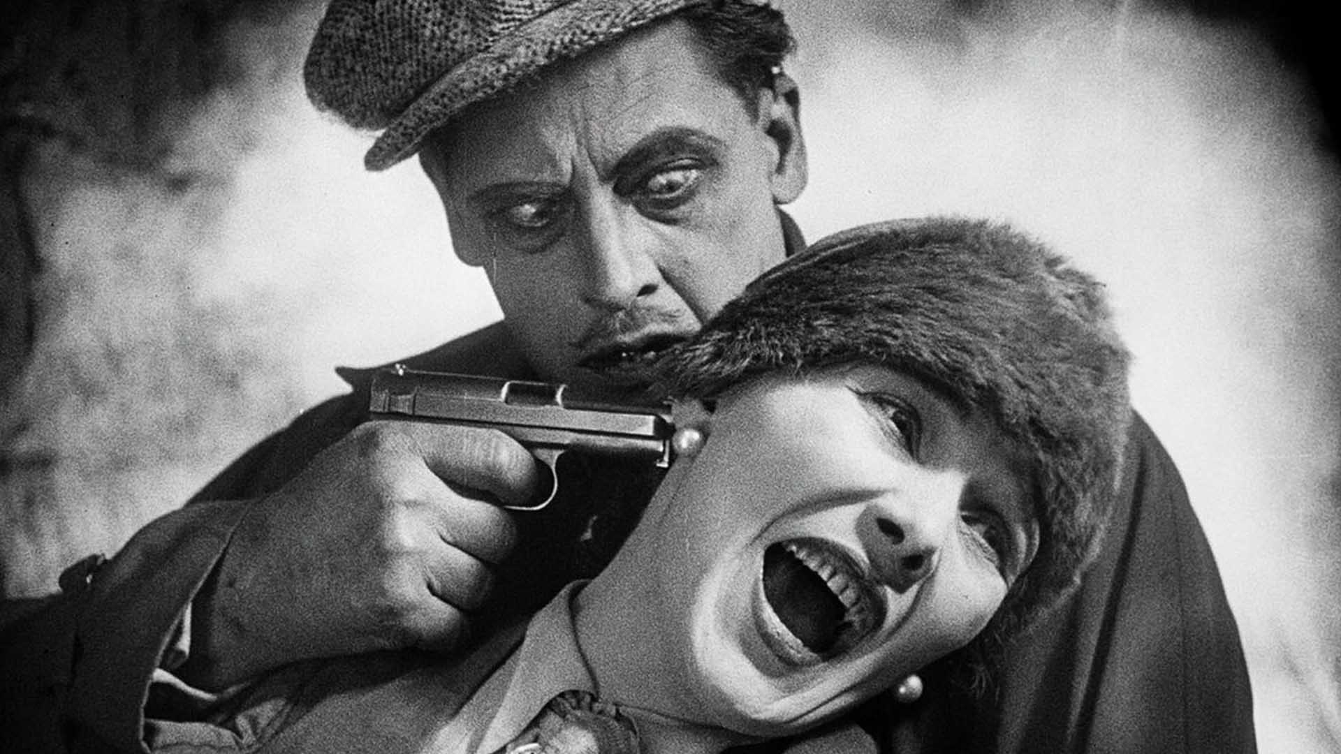 Rudolf Klein-Ruge puts a gun to Willie Fritch's head in Spione