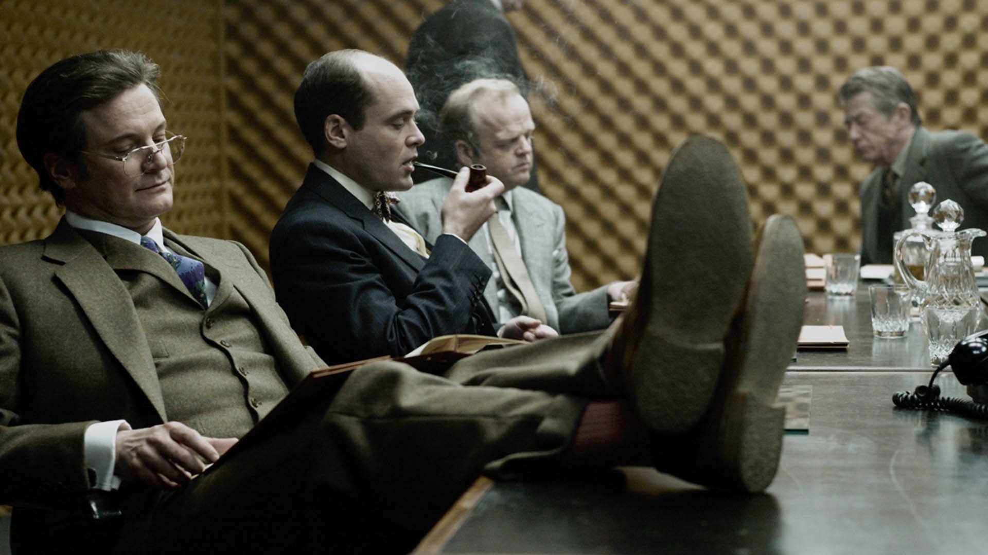 Toby Jones and Colin Firth studying in Tinker Tailor Soldier Spy