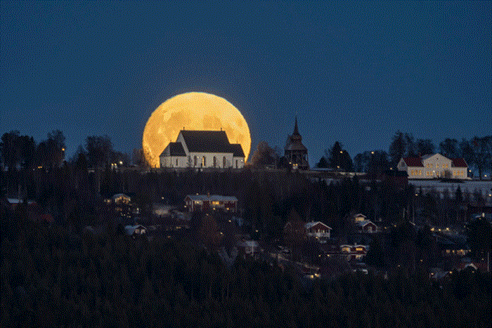 Photography of the moon behind the 800-year-old church