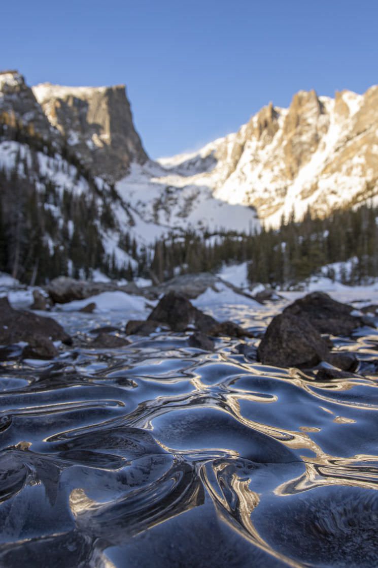 Frozen mountain lake in Colorado by Eric Gross
