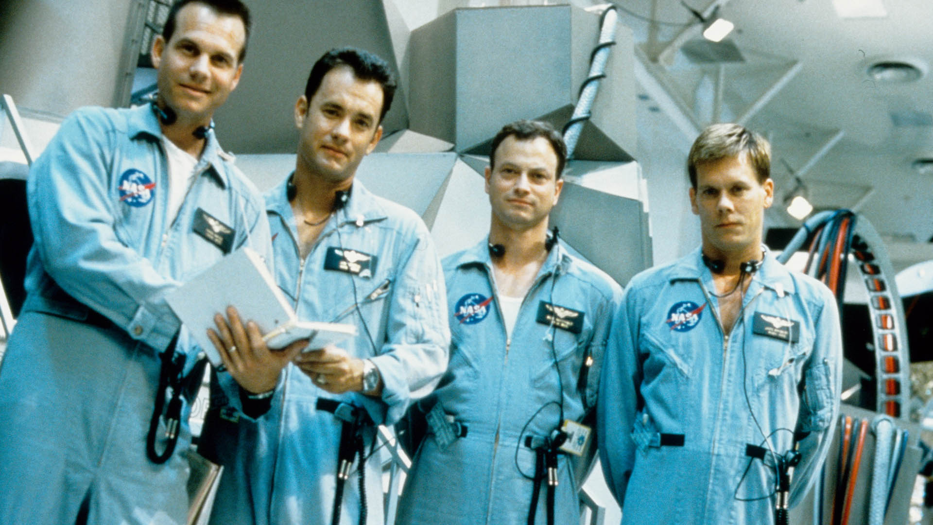 The main characters of the movie Apollo 13 in astronaut suits